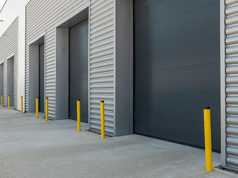 Exterior of an industrial unit with metal roller shutter doors